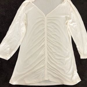 Beige see through top.